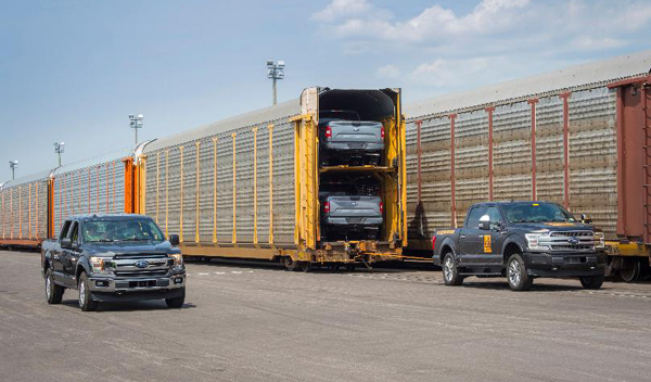 Loading pickup trucks onto an autorack railcar